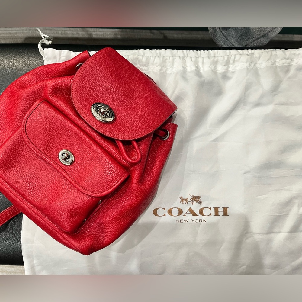 Bright red leather Coach backpack with storage bag - gently used